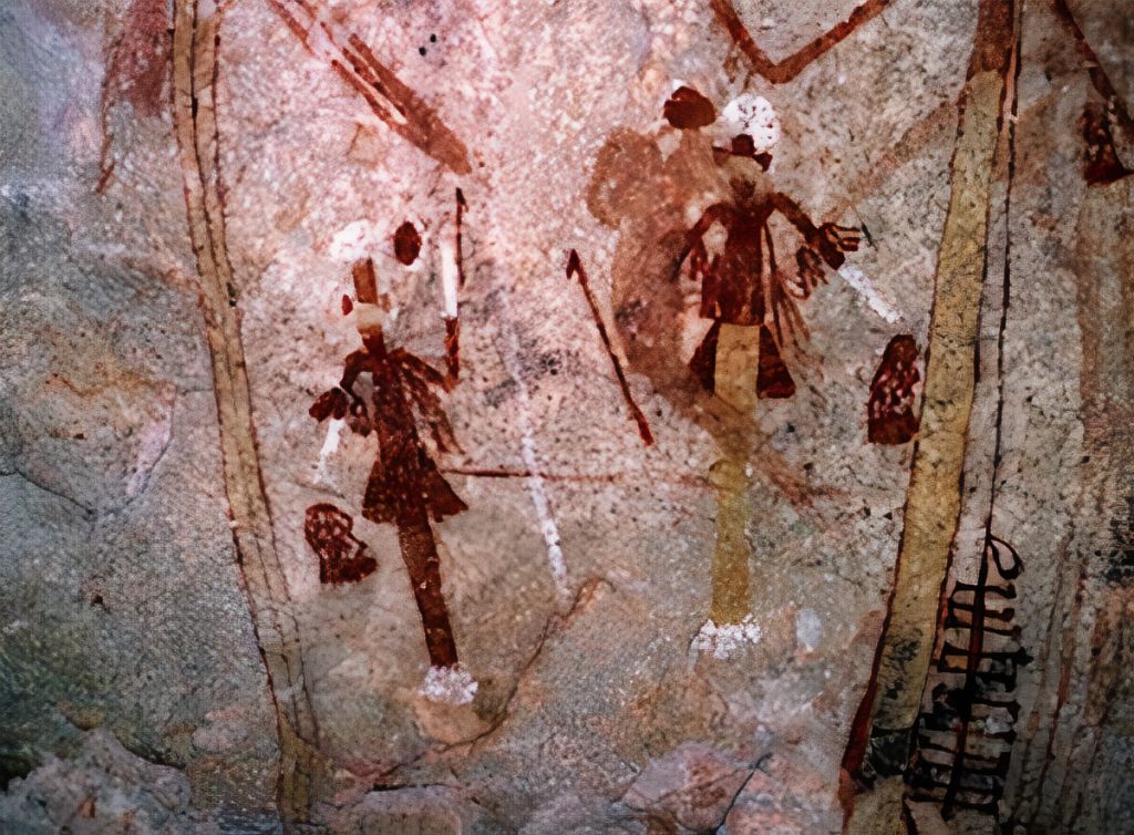 Similar bucket-like or barrel-like headdresses are worn by painted Straight Part Figures in the northern Kimberley